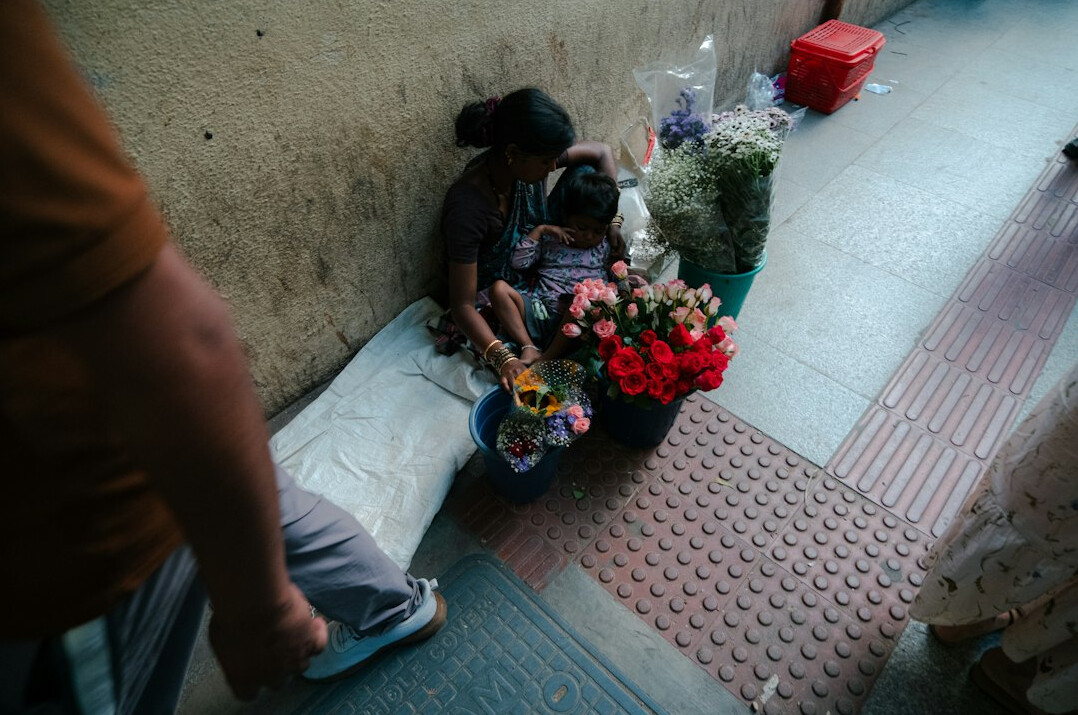 woman selling flowers on street