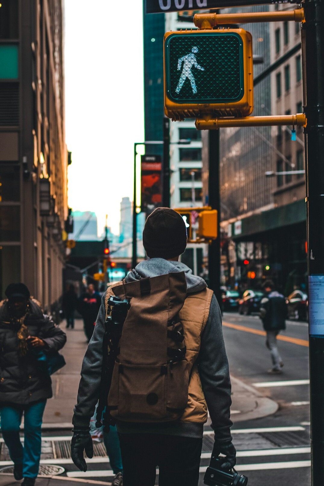 person walking on city street