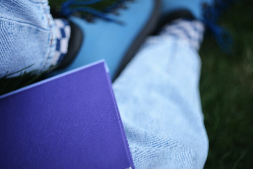 Journalist taking notes in a notebook outdoors