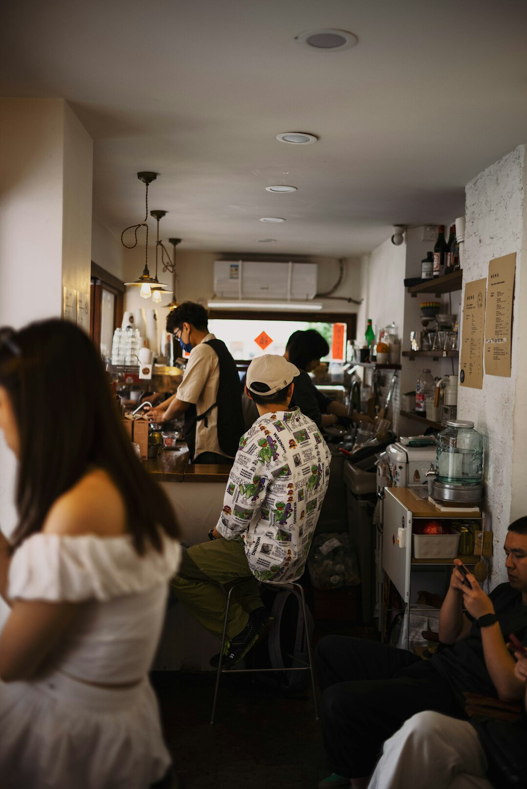 People talking inside a small cafe