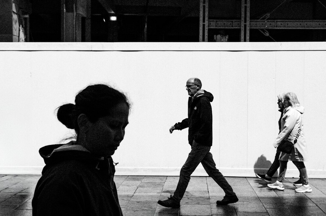 elderly person smiling at market