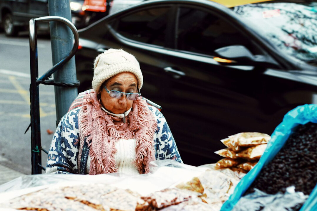 Woman selling fruit at a Santiago street market