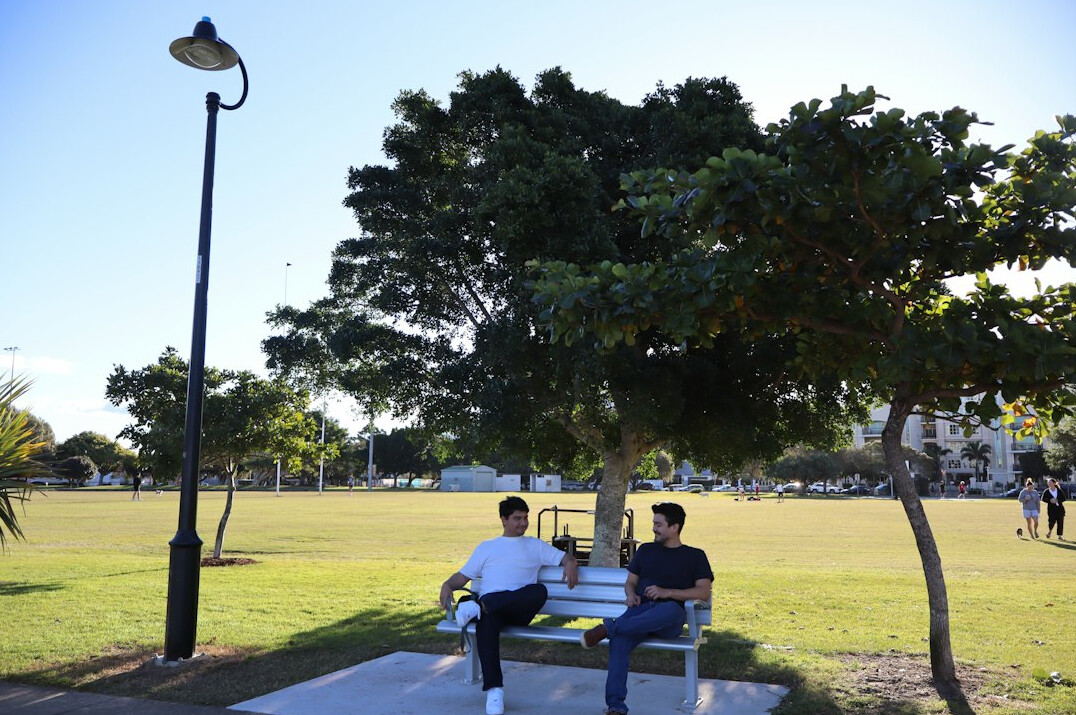 strangers chatting on park bench