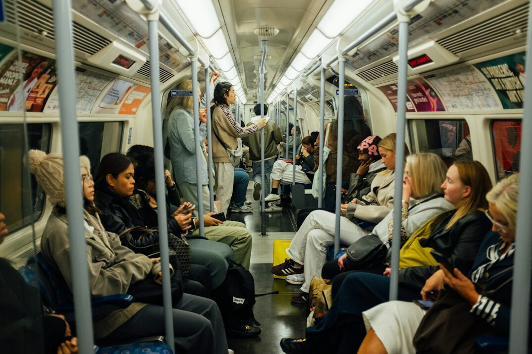 diverse commuters on train