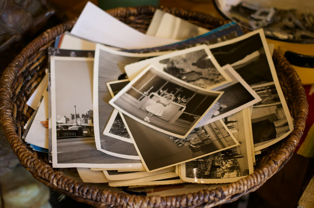 Stack of old newspapers and photographs